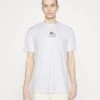 Lacoste UNISEX - T-shirt Z Nadrukiem - White